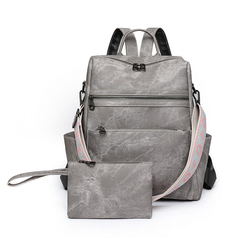 sac a dos femme et sa pochette gris
